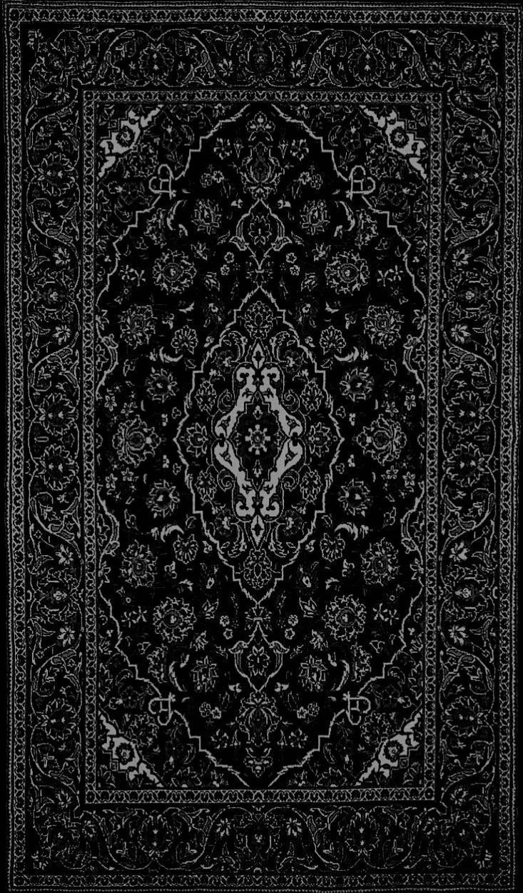 Black and white ornamental textile with a central medallion
